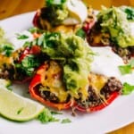 delicious plate of taco stuffed bell peppers with lime