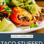 graphic with dark blue background text on the bottom of a photo of taco stuffed bell peppers with guacamole