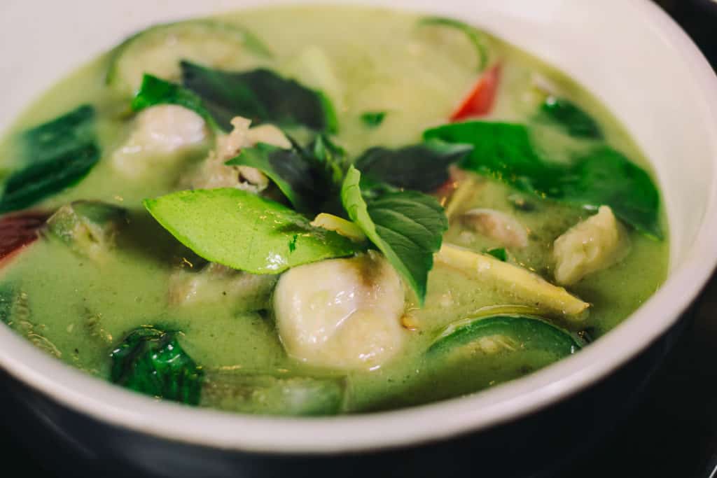 bowl of green thai curry with chicken