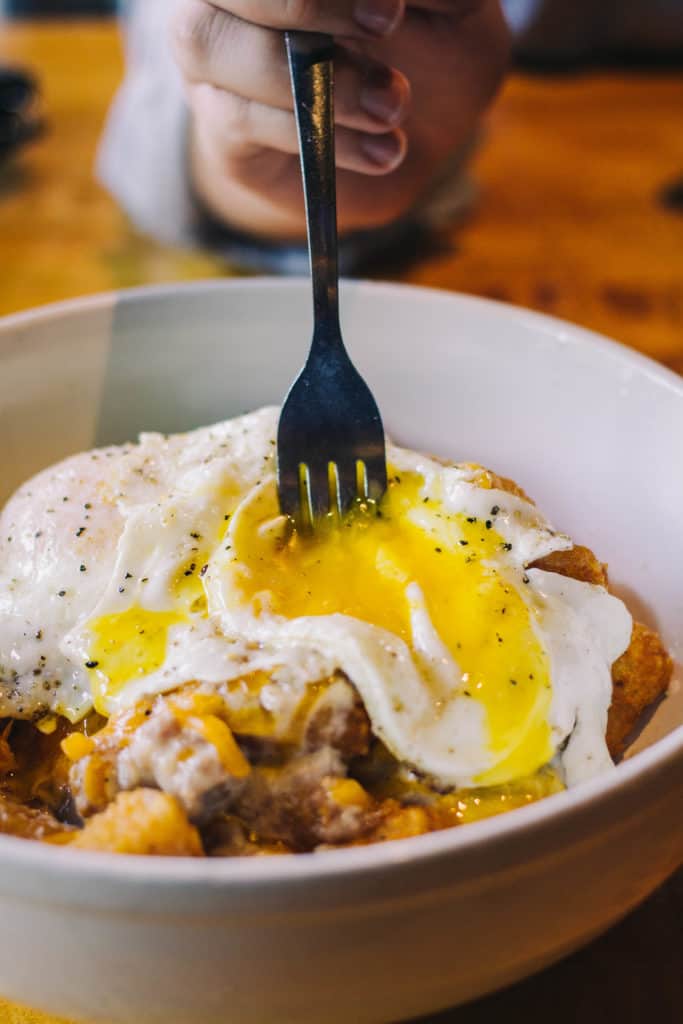 bubba's burgers poutine with a runny egg yolk