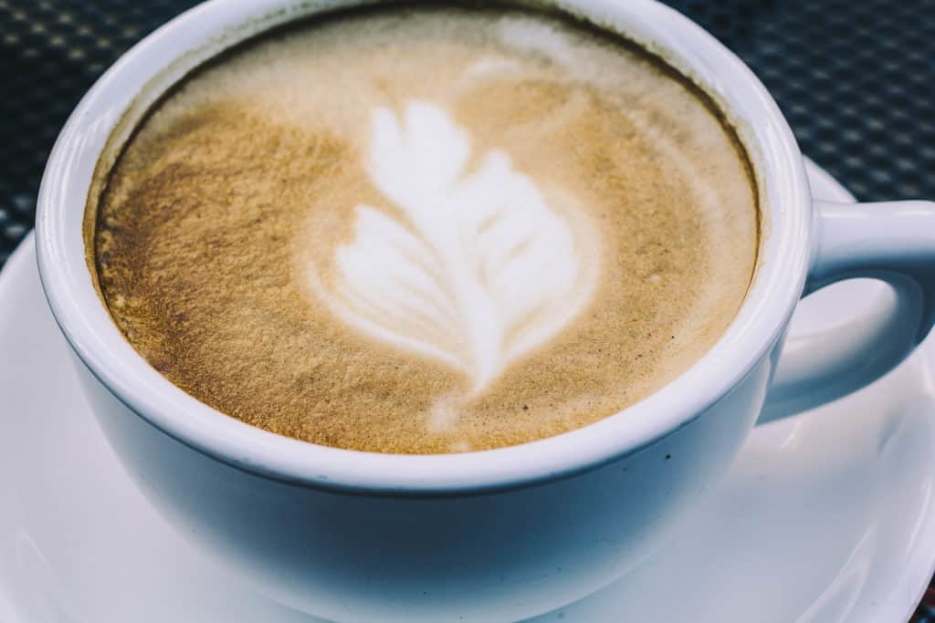 caffe arrivadolce latte art in a mug