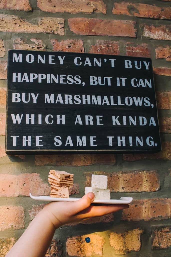 sign that says money cant buy happiness, but it can buy marshmallows which are kinda the same thing