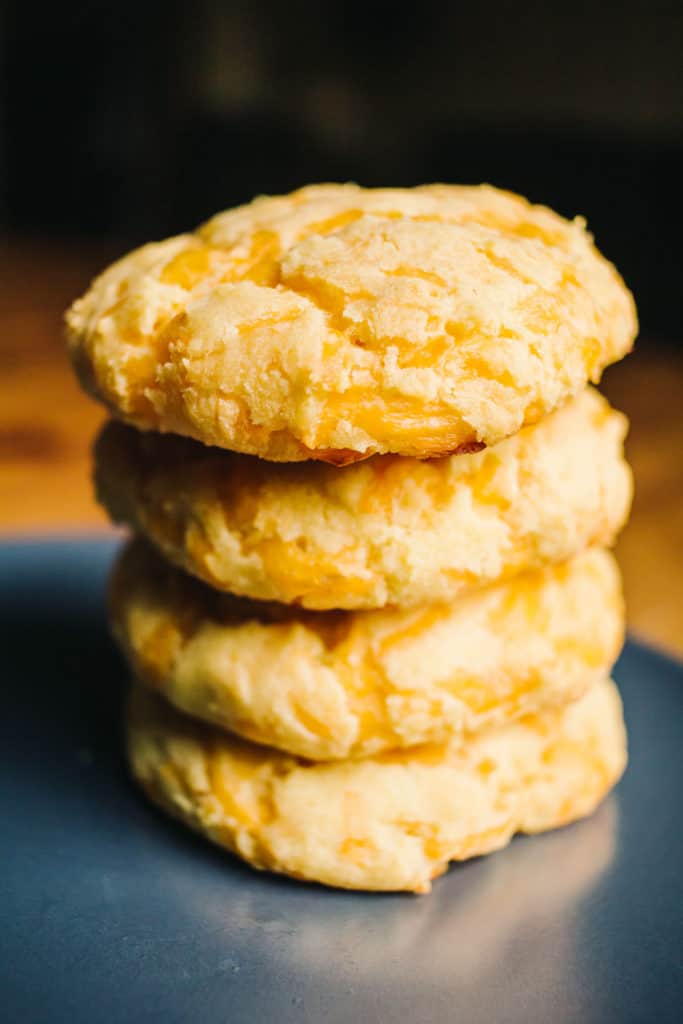stack of low carb cheddar biscuits on a grey plate