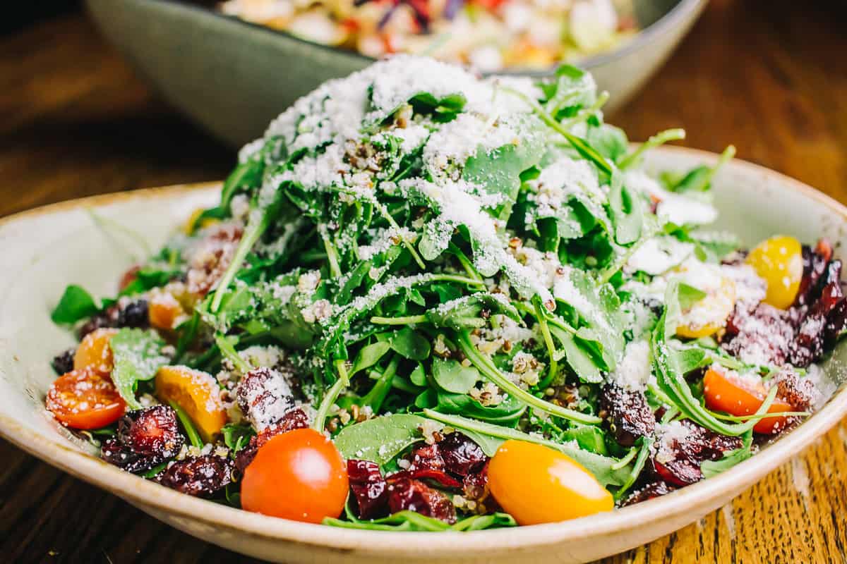 baby arugula salad with tomatoes and parmesan cheese