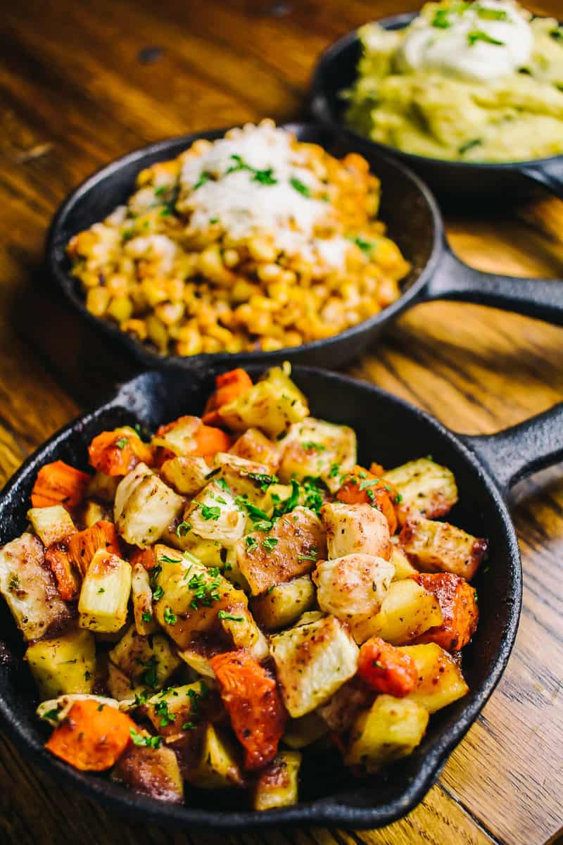trio of vegetable sides served in small cast iron skillets
