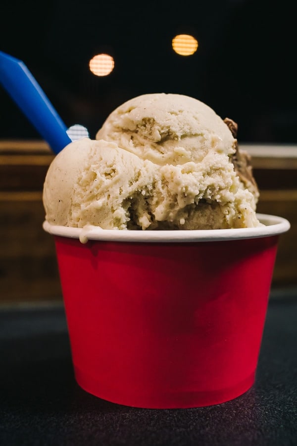 red cup filled with ice cream with lovely bokeh in the background