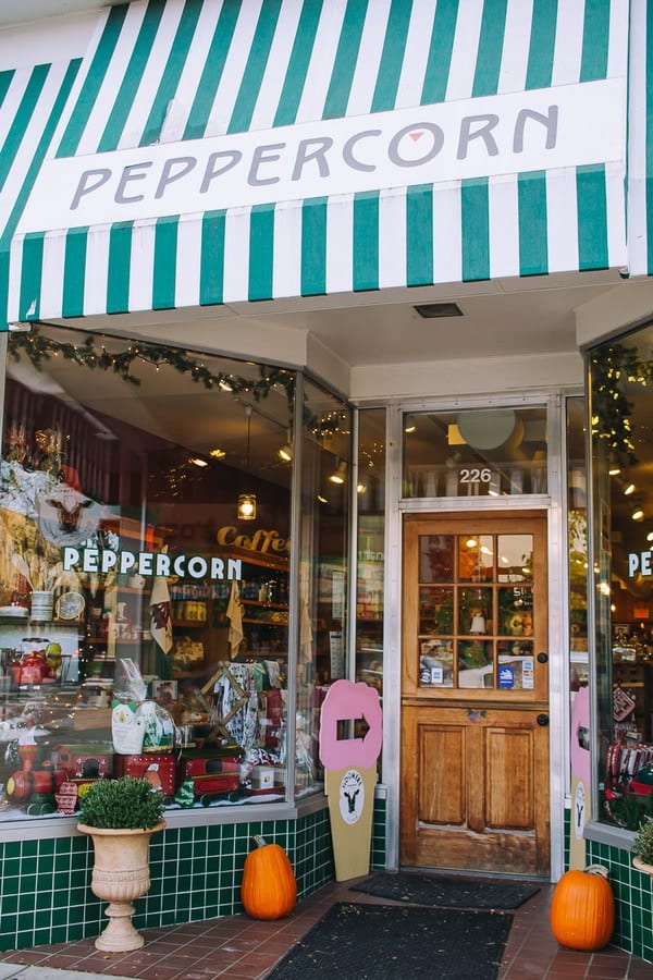 outside of the peppercorn store with a striped green awning in traverse city