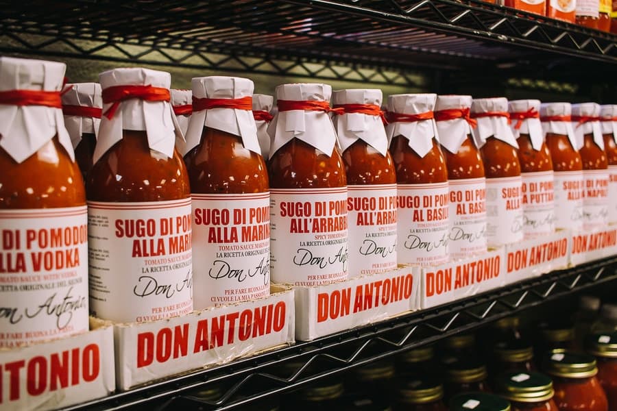 authentic italian tomato and marinara sauce bottles on a shelf