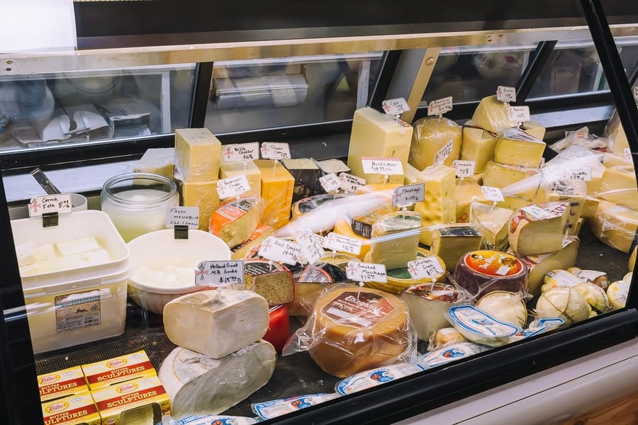 assorted cheeses at a deli counter
