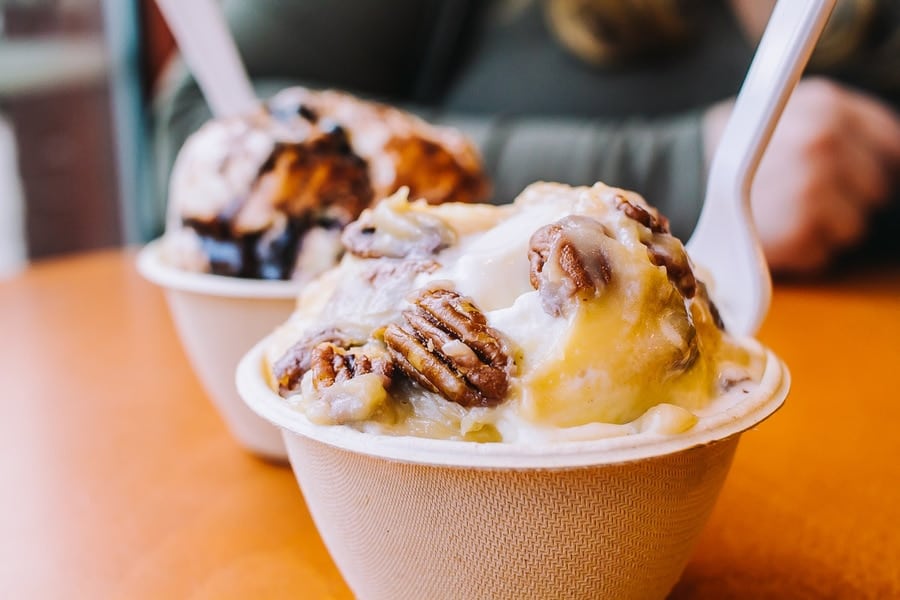 two cups of ice cream with pecans 