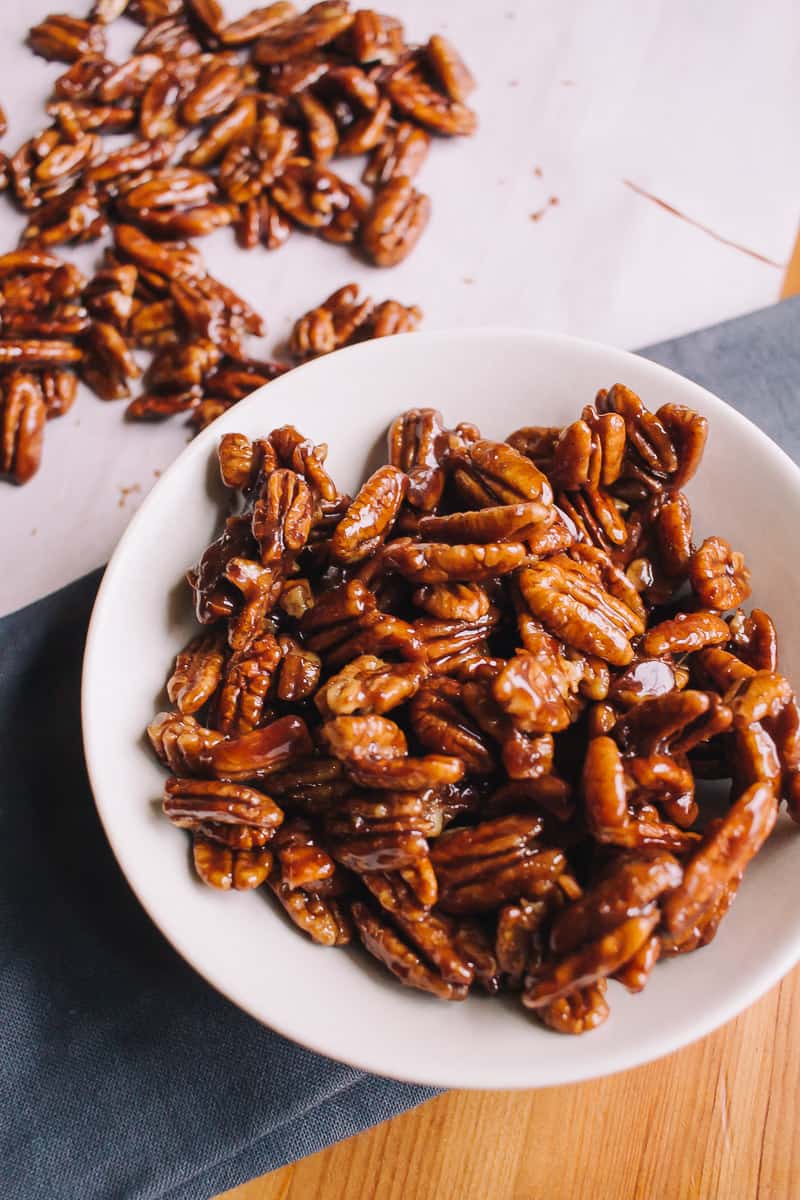 candied pecans in a white bowl