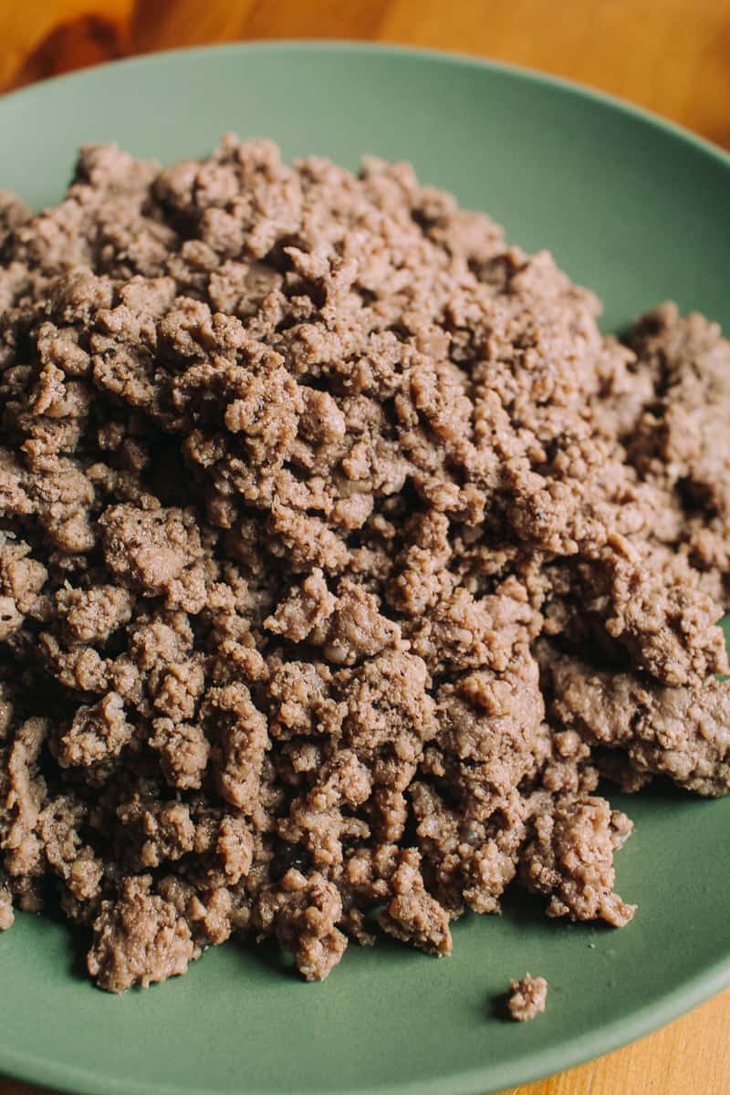 ground beef on a green plate