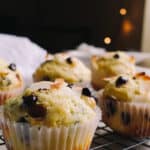Low Carb Coconut and Chocolate Chip Protein Muffins on a plate with a white linen napkin