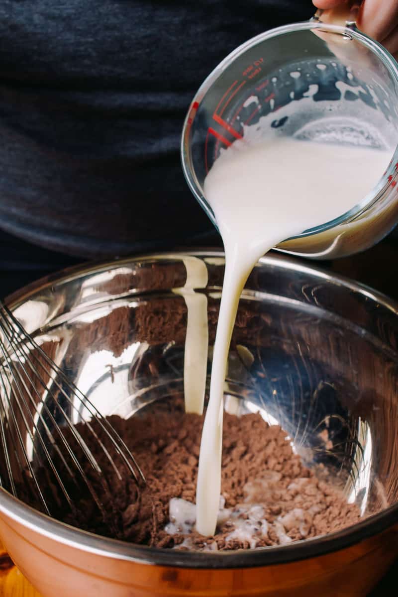 Pouring almond milk in batter