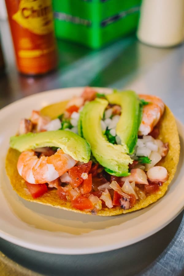 seafood tostada with shrimp and avocados