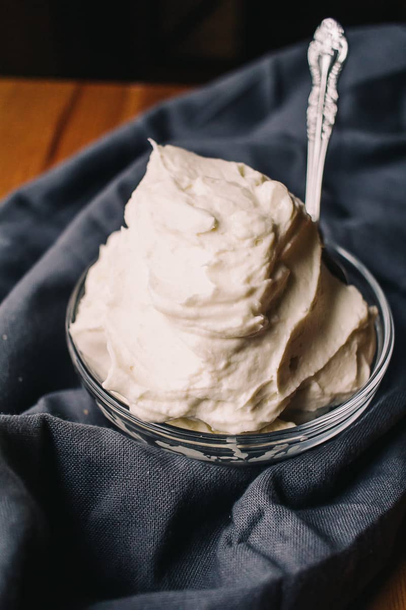 Easy Low Carb Cream Cheese Frosting on a blue napkin with a spoon