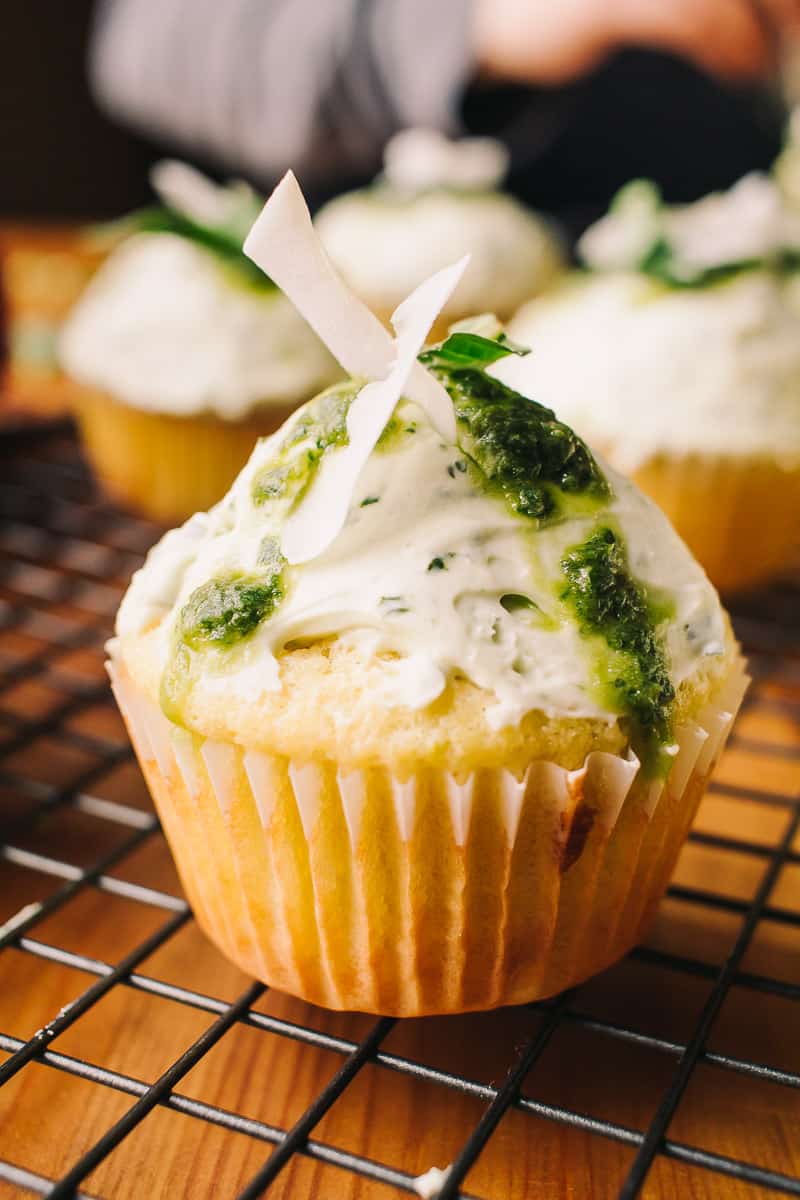 Low Carb Thai Basil Lime and Coconut Cupcakes topped with coconut