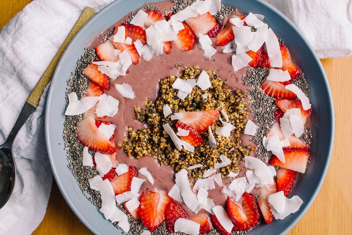 Acai Smoothie Bowl with strawberries, hemp hearts, chia seeds and coconut flakes