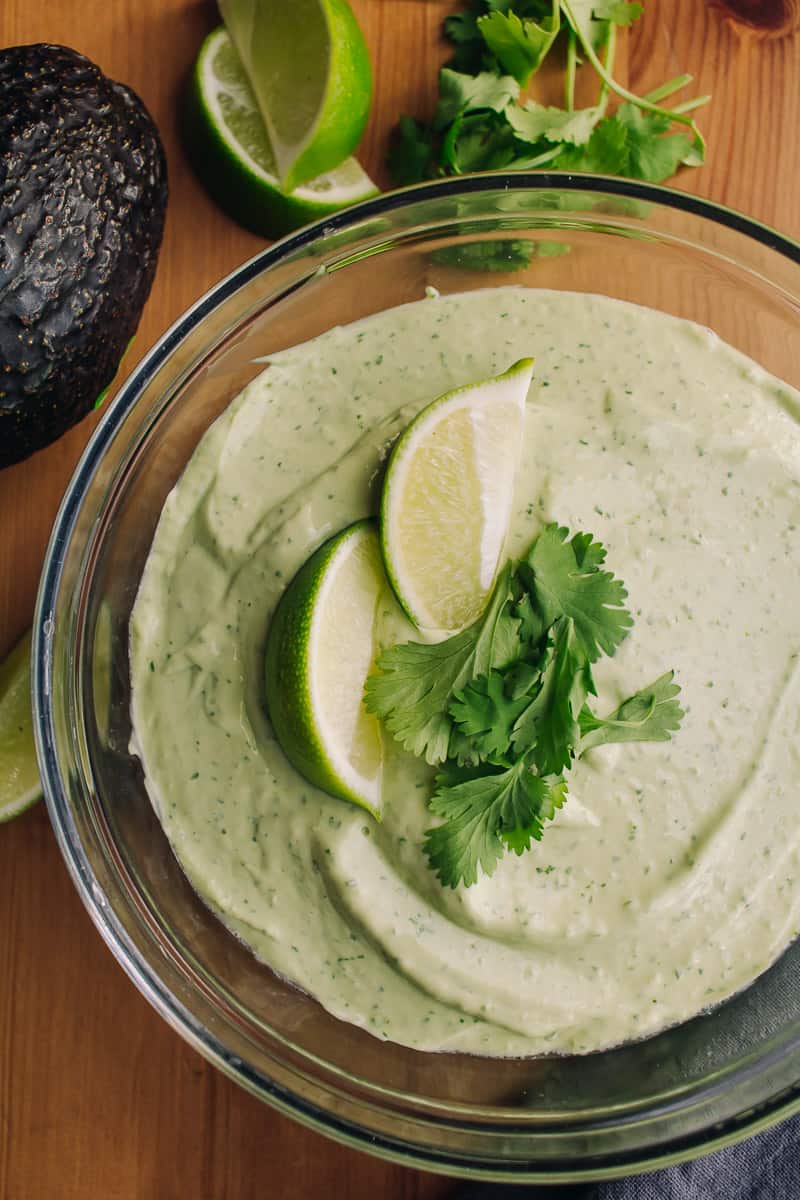 bowl of avocado and lime crema with cilantro