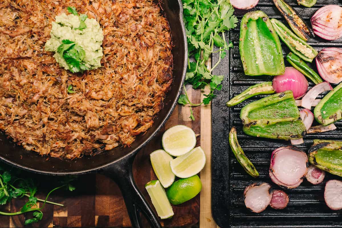 Pressure Cooker Pork Carnitas with grilled vegetables in cast iron