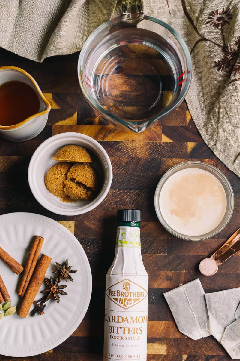 Sugar Free Spiked Chai Tea Ingredients with cinnamon sticks star anise and cardamom pods 