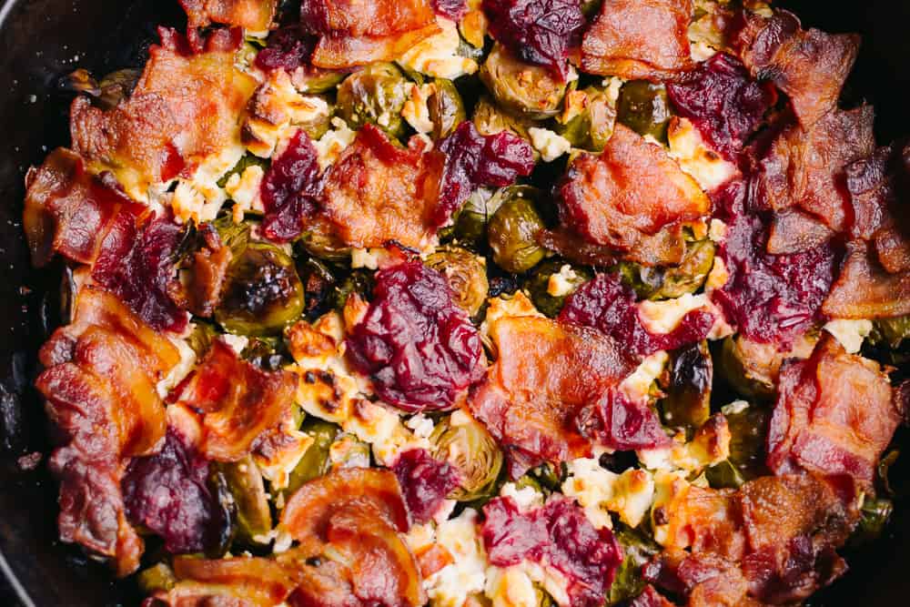 bacon, Brussel sprouts, cranberries and goat cheese in a cast iron skillet