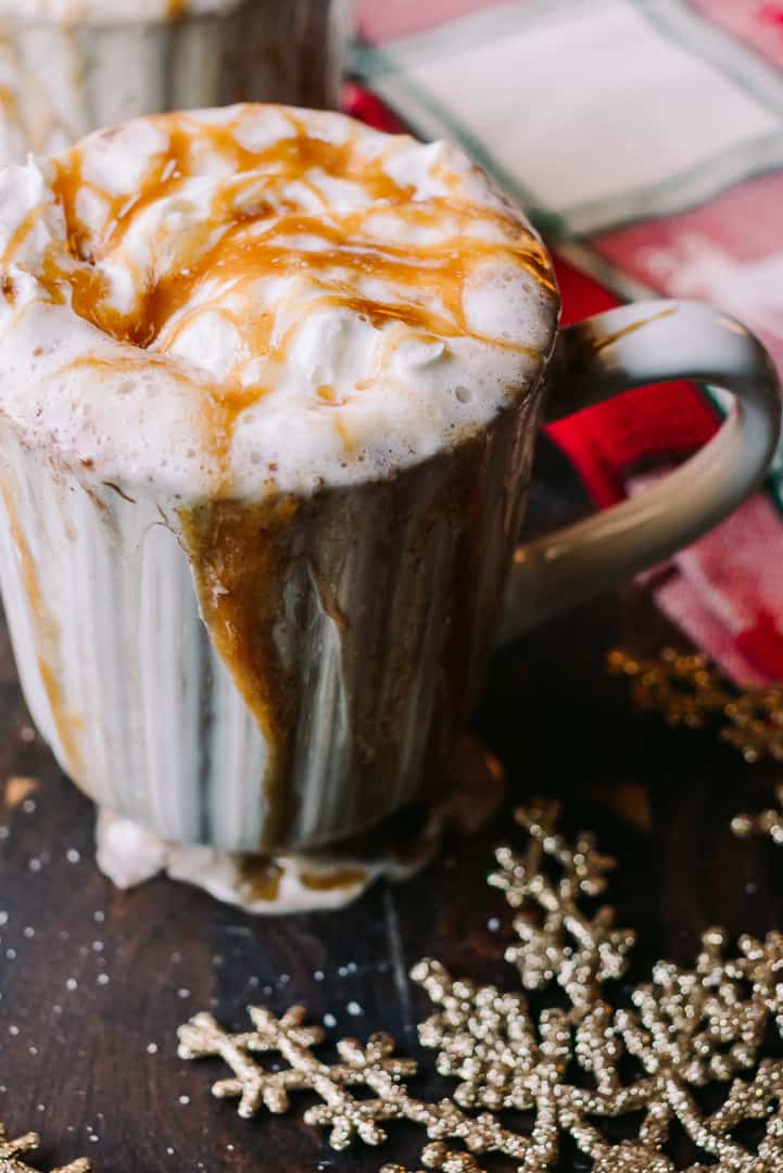salted caramel sauce drizzling from a hot cocoa mug