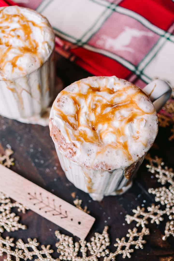 closeup of a christmas themed salted caramel hot cocoa with snowflakes