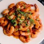White plate with maple bbq shrimp