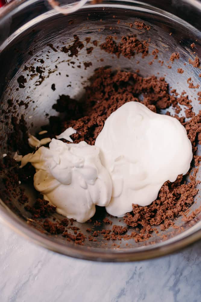 adding whipped cream to low carb chocolate and peanut butter mixture