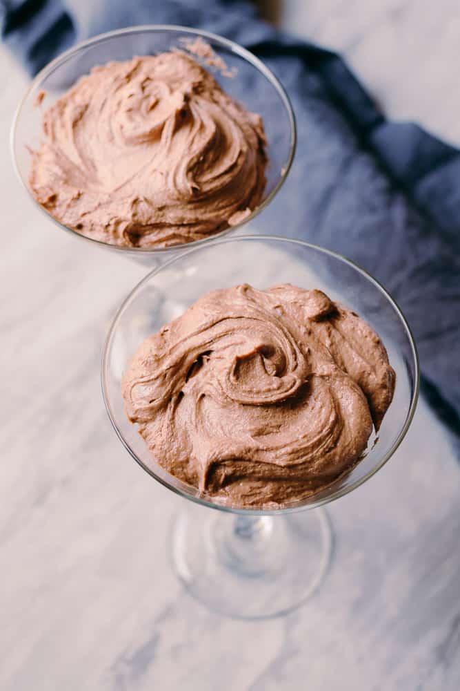 two martini glasses with low carb chocolate peanut butter mousse