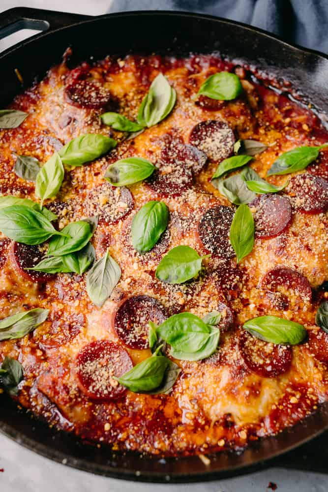 pepperonis, Italian basil, cheese baked in a cast iron skillet