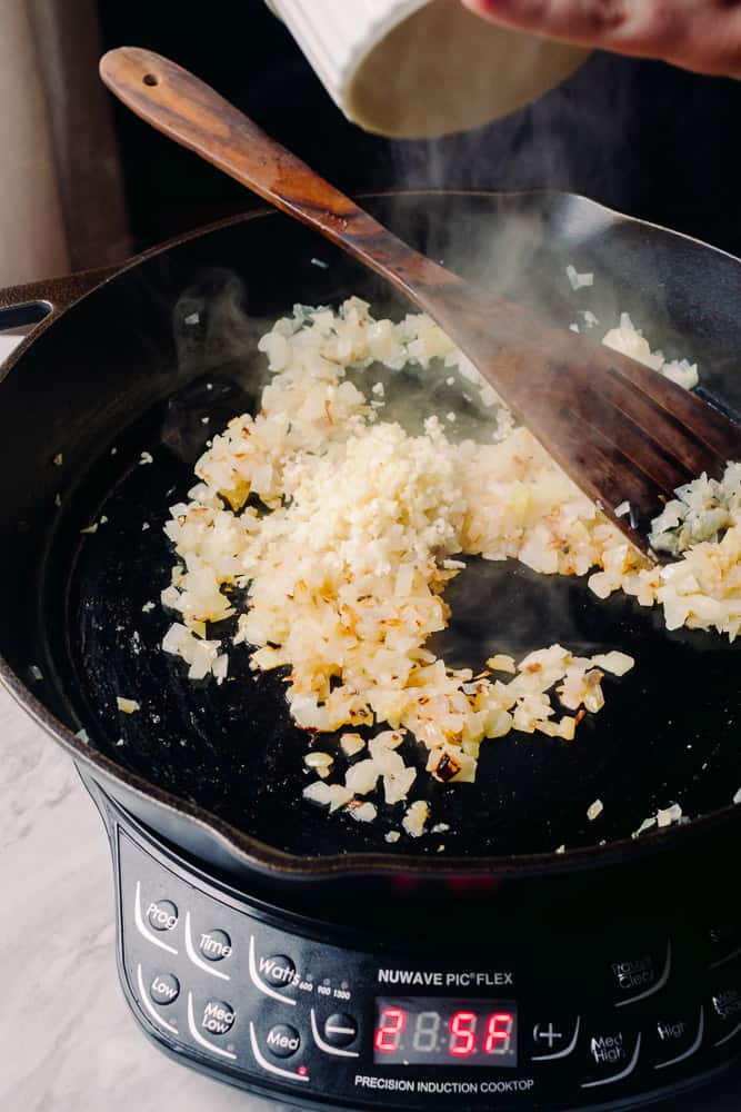 caramelized onion and garlic in a cast iron skillet