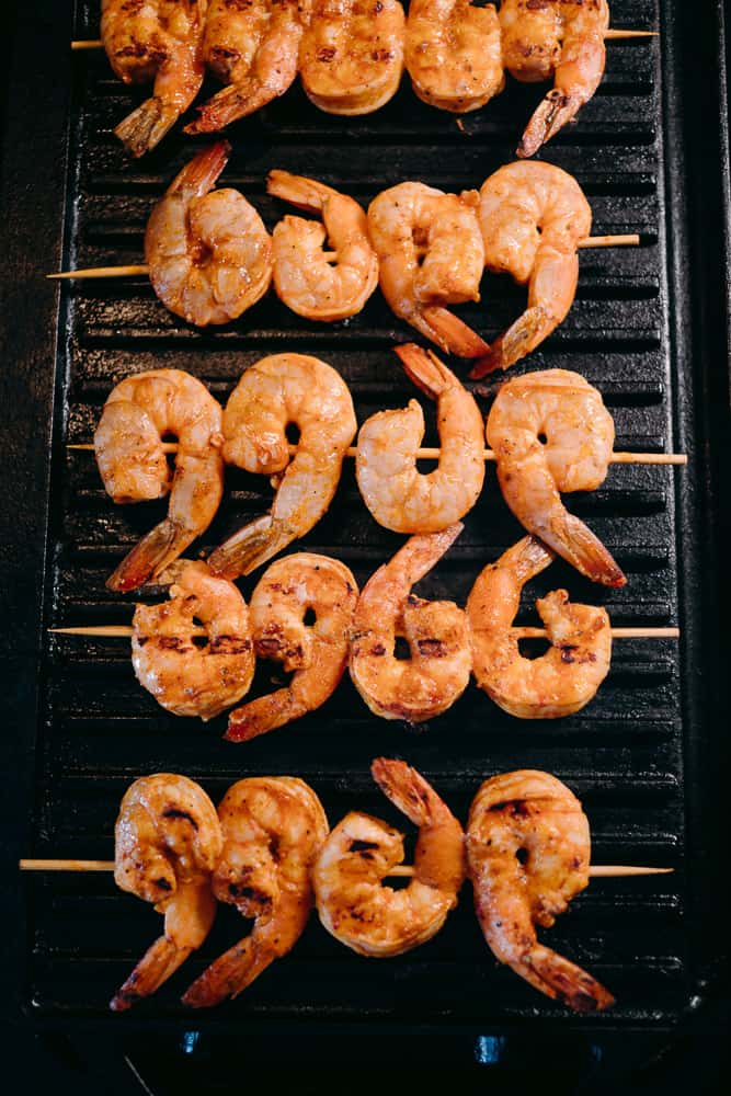chipotle lime shrimp on the grill on skewers