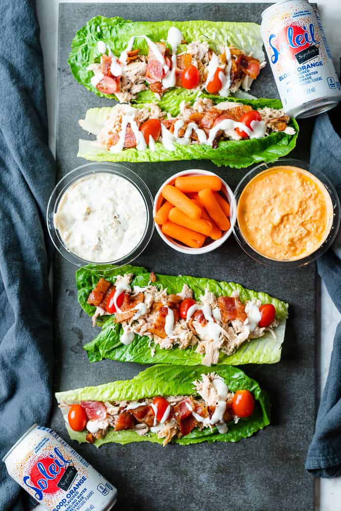 chicken bacon ranch lettuce wraps with tomatoes, carrots and dip