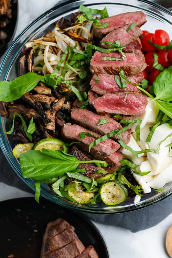 sirloin steak salad with fresh basil and roasted veggies