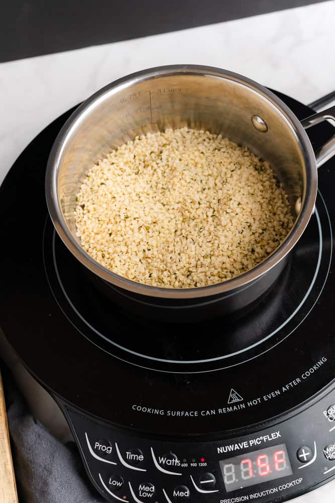 pot full of hemp heart seeds on the stove