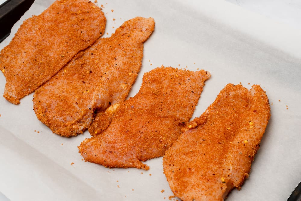 raw chicken coated with seasonings