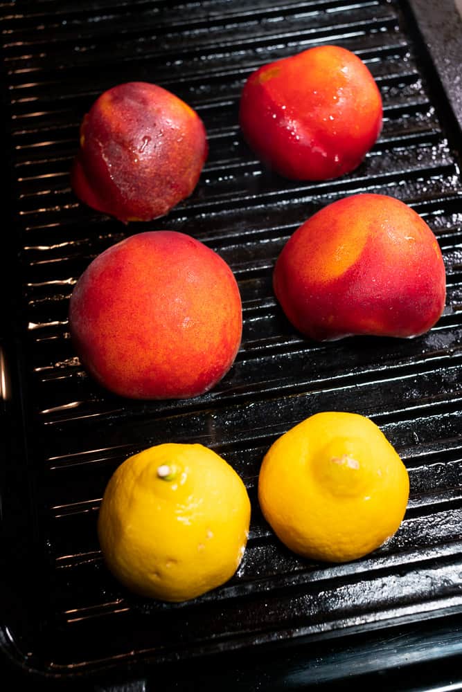 grilling peaches and lemons on a cast iron griddle