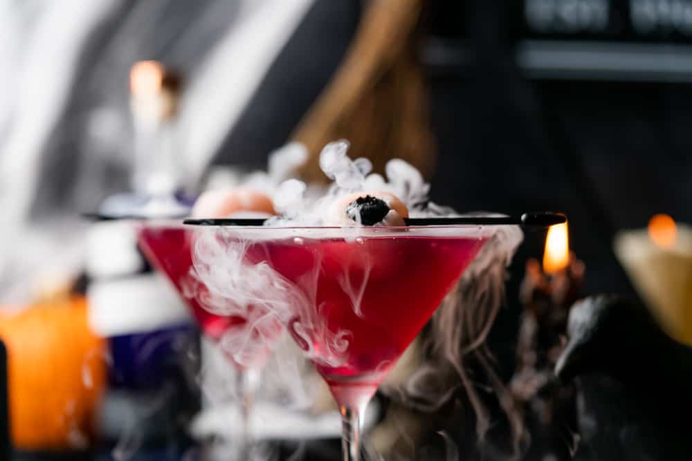 smoking purple people eater drink cocktail with lychee eyeball