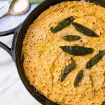 cast iron with baked pumpkin goat cheese dip and sage
