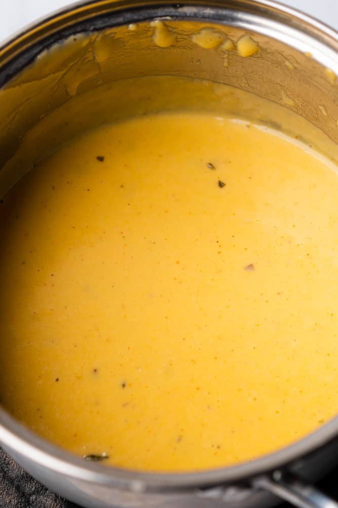 creamy cheese sauce in a sauce pan