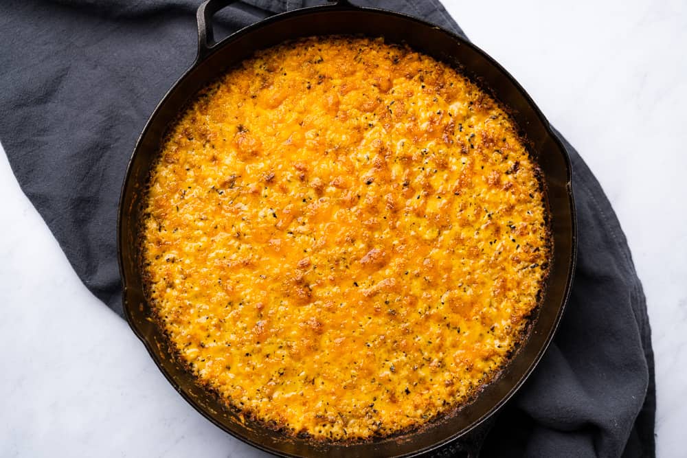 cauliflower mac and cheese in a cast iron skillet