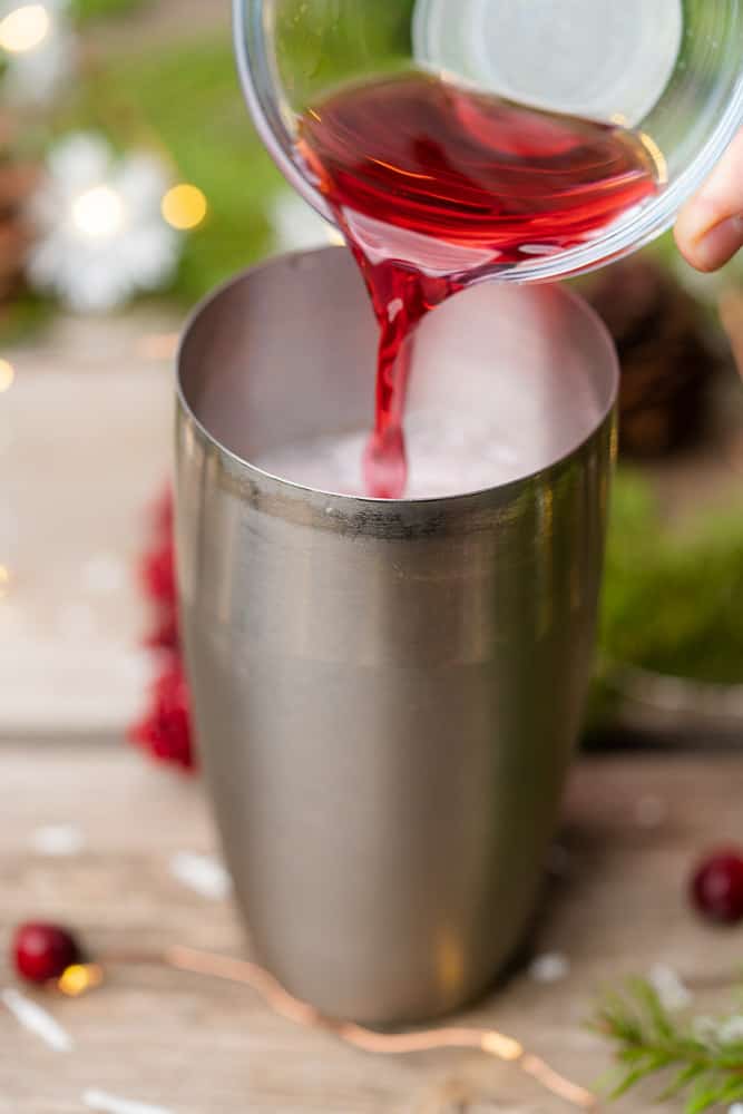 cranberry juice into a cocktail shaker