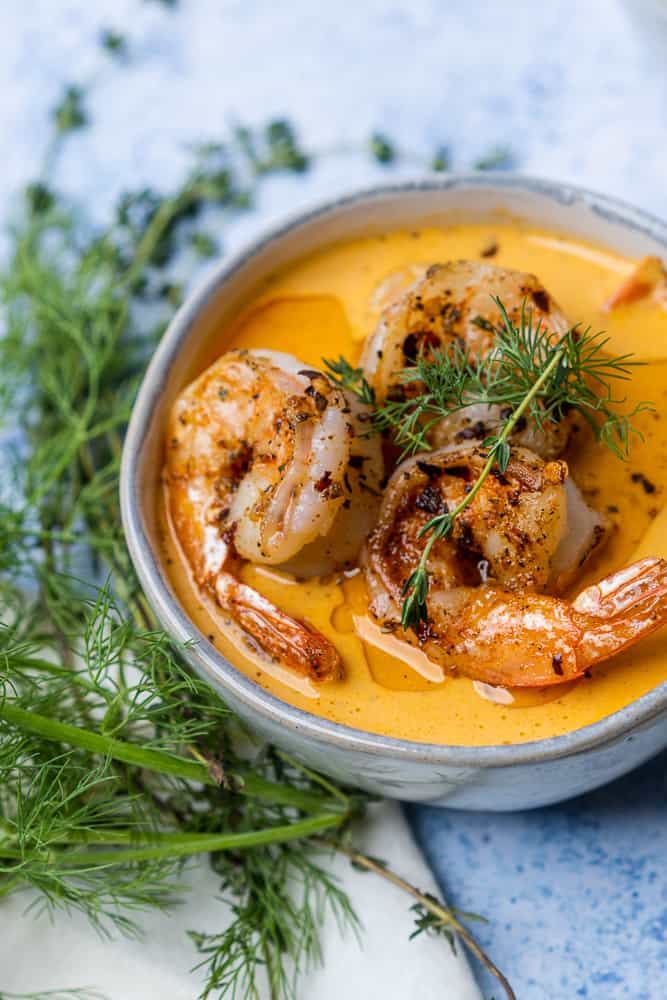 glorious bowl of seafood soup with fresh herbs