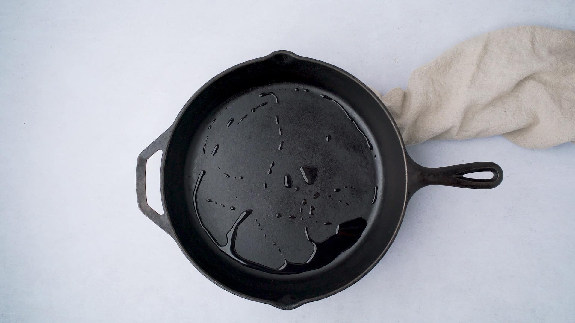 drying. a cast iron skillet with water in it over heat