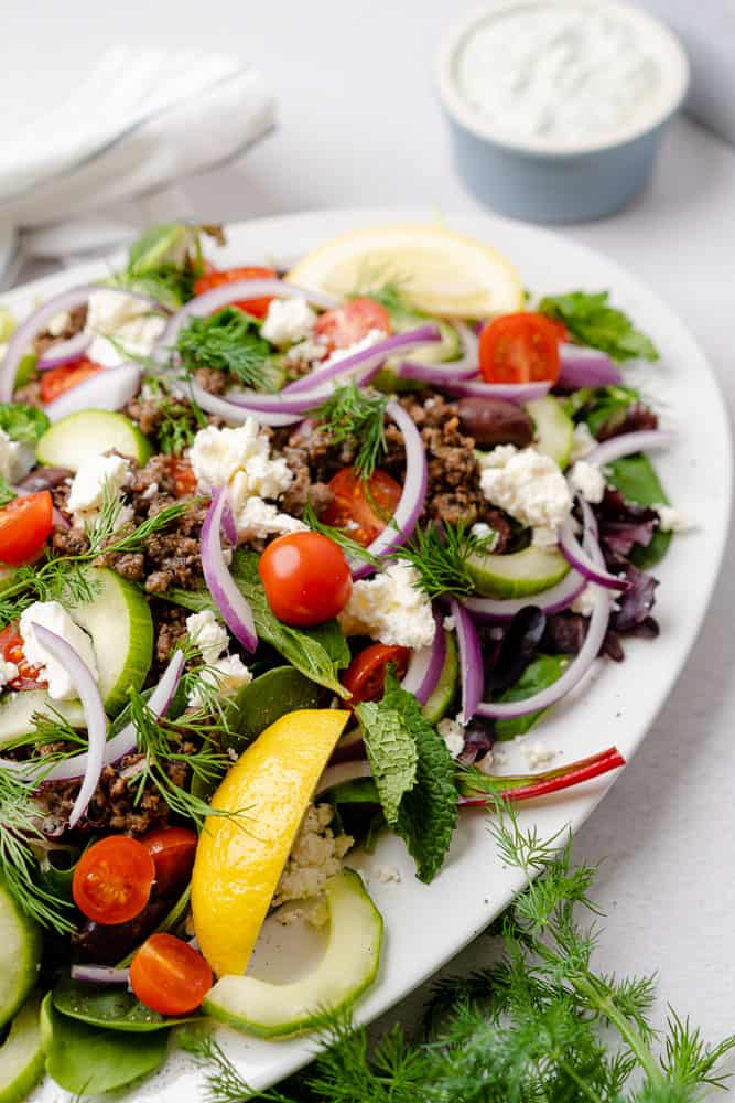 closeup shot of a greek salad with lamb