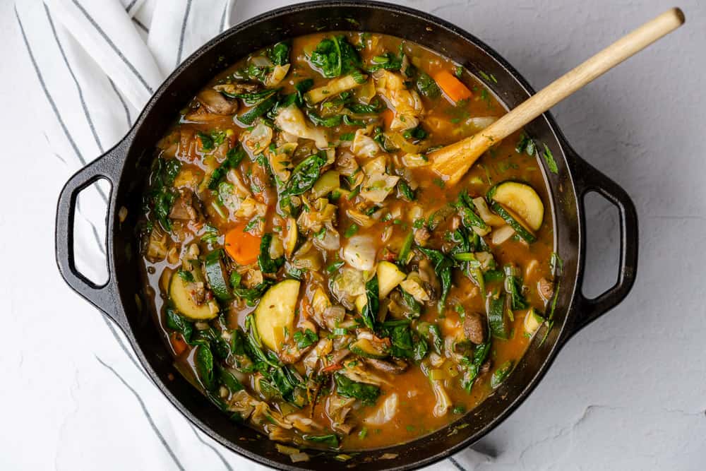 vegetable soup in a lodge cast iron dutch oven