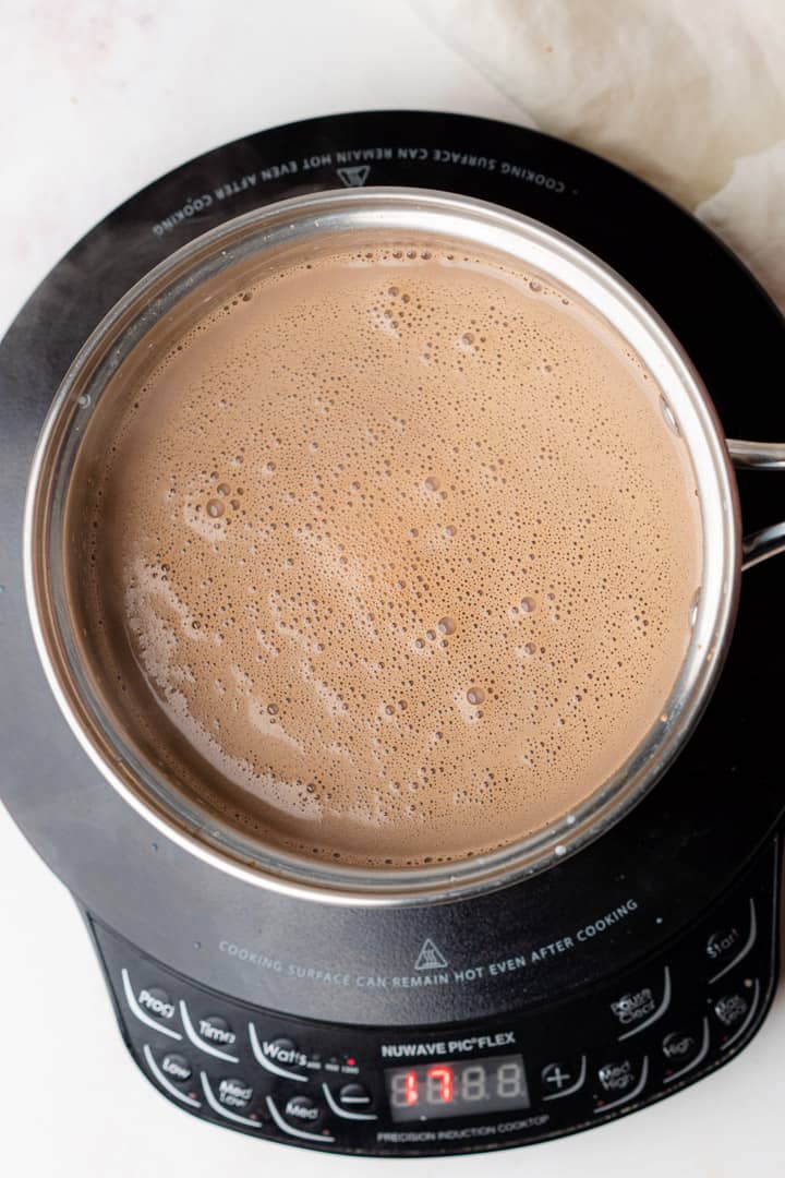 bubbly hot cocoa in a pan
