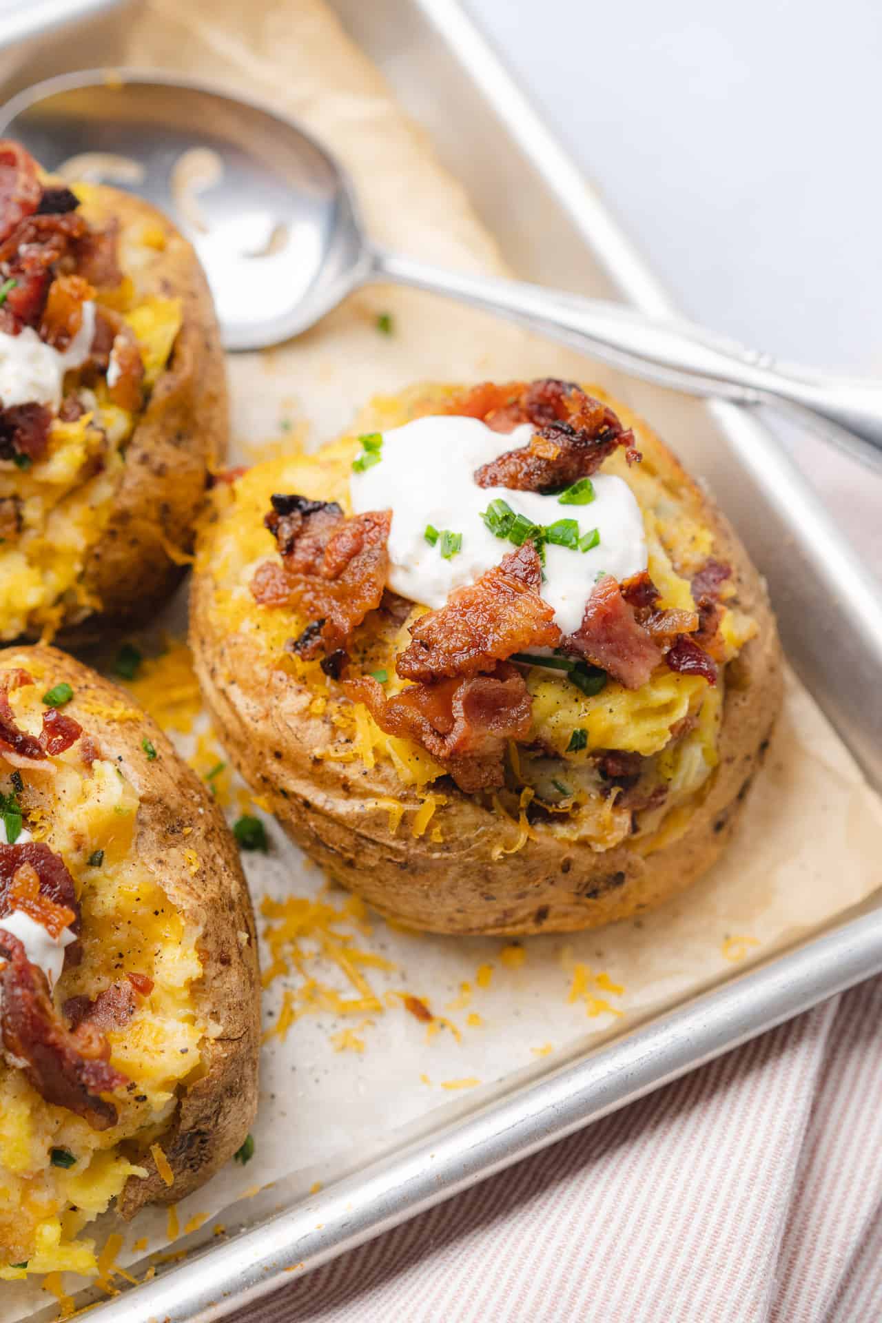 Loaded twice baked breakfast potato with sour cream and chives